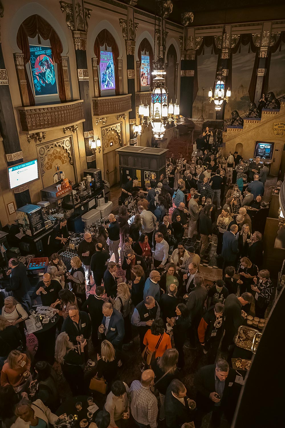 Bird eye view of a sea of people filling the Oriental Theatre lobby.