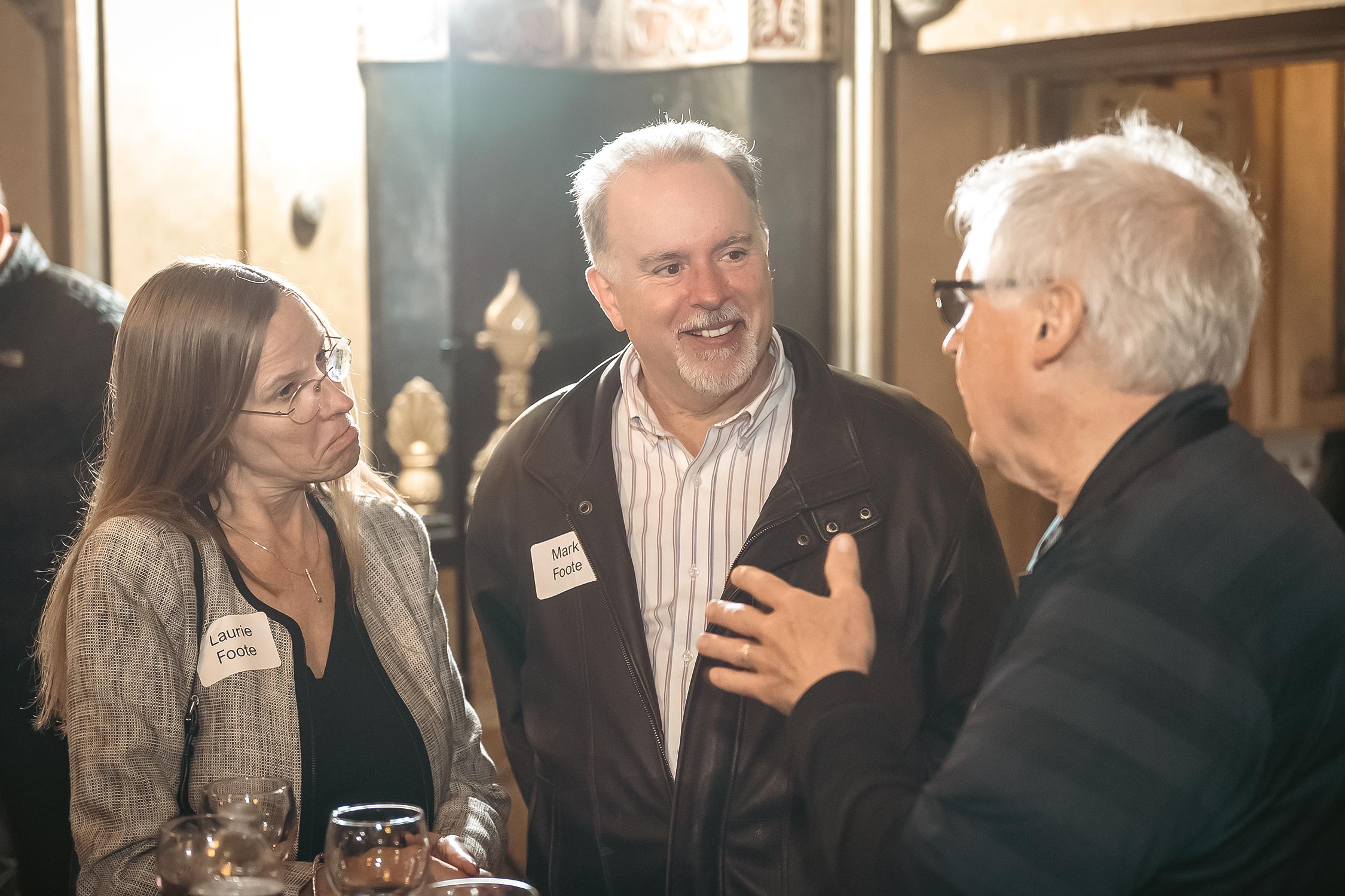 Guests having a conversation inside the Oriental Theatre lobby.