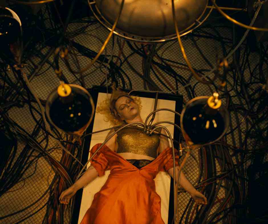 The Bride Film Still The Bride of Frankenstein lies on an operating table surrounded by tubes and wires.