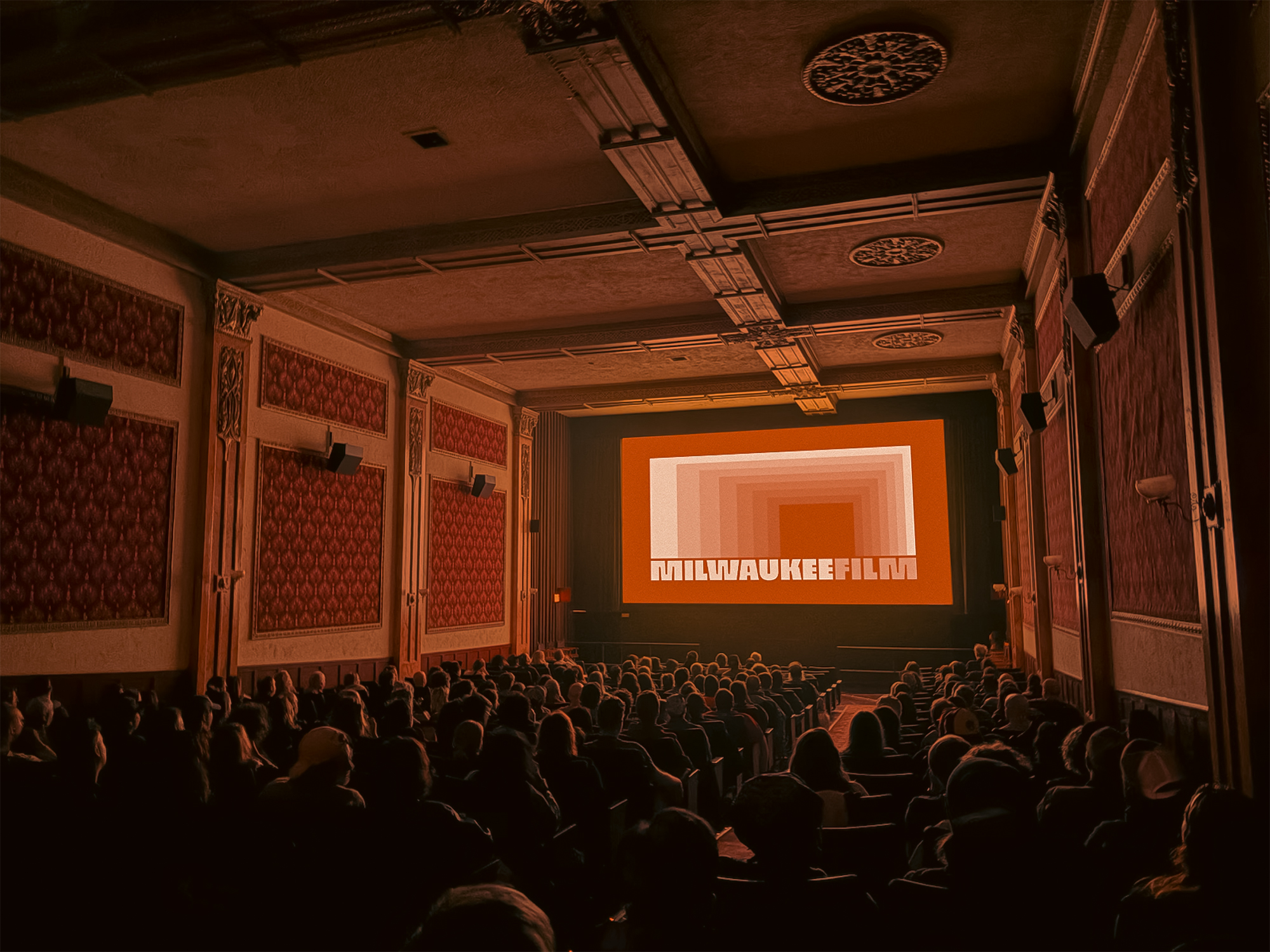 The new Milwaukee Film logo onscreen a the Downer Theatre.