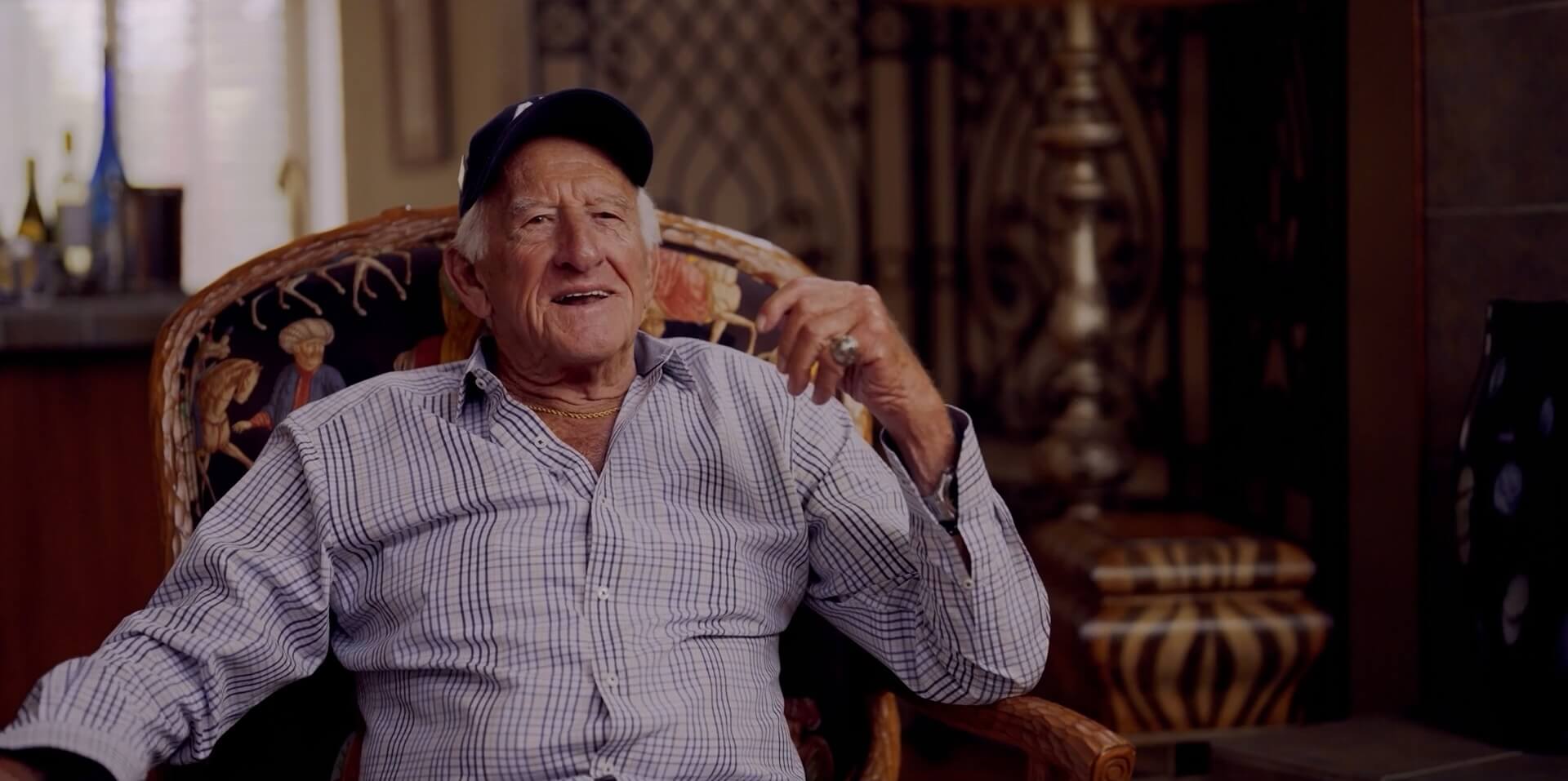 Ueck Film Still Bob Uecker sitting in an armchair